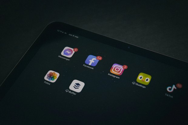 Tablet home screen showing the Duolingo icon alongside social media apps